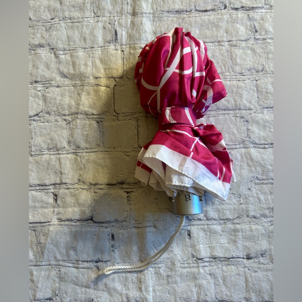 STORM DUDS PINK AND WHITE PATTERNED SILVER TONE HARDWARE SMALL UMBRELLA